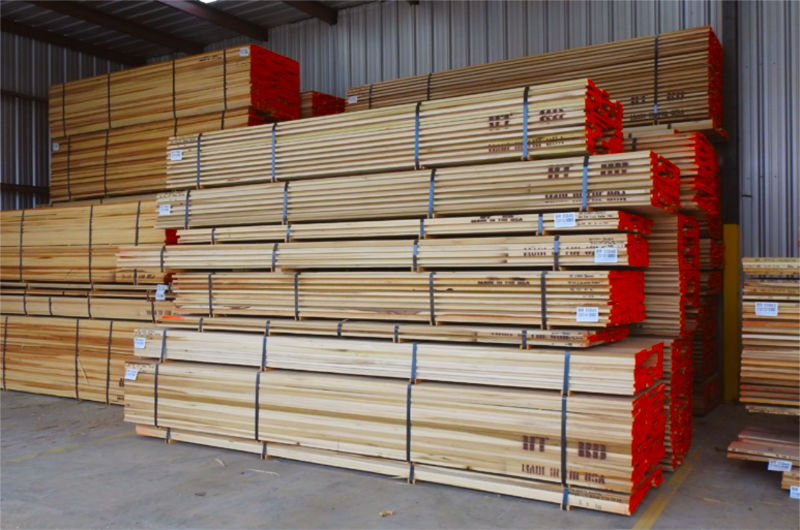 Hardwood lumber is stacked for shipping.