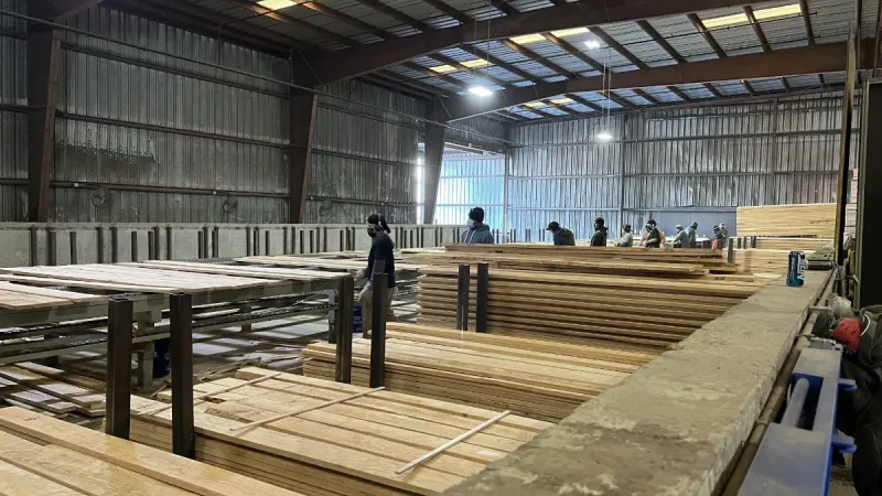 Wood is being organized and stacked.